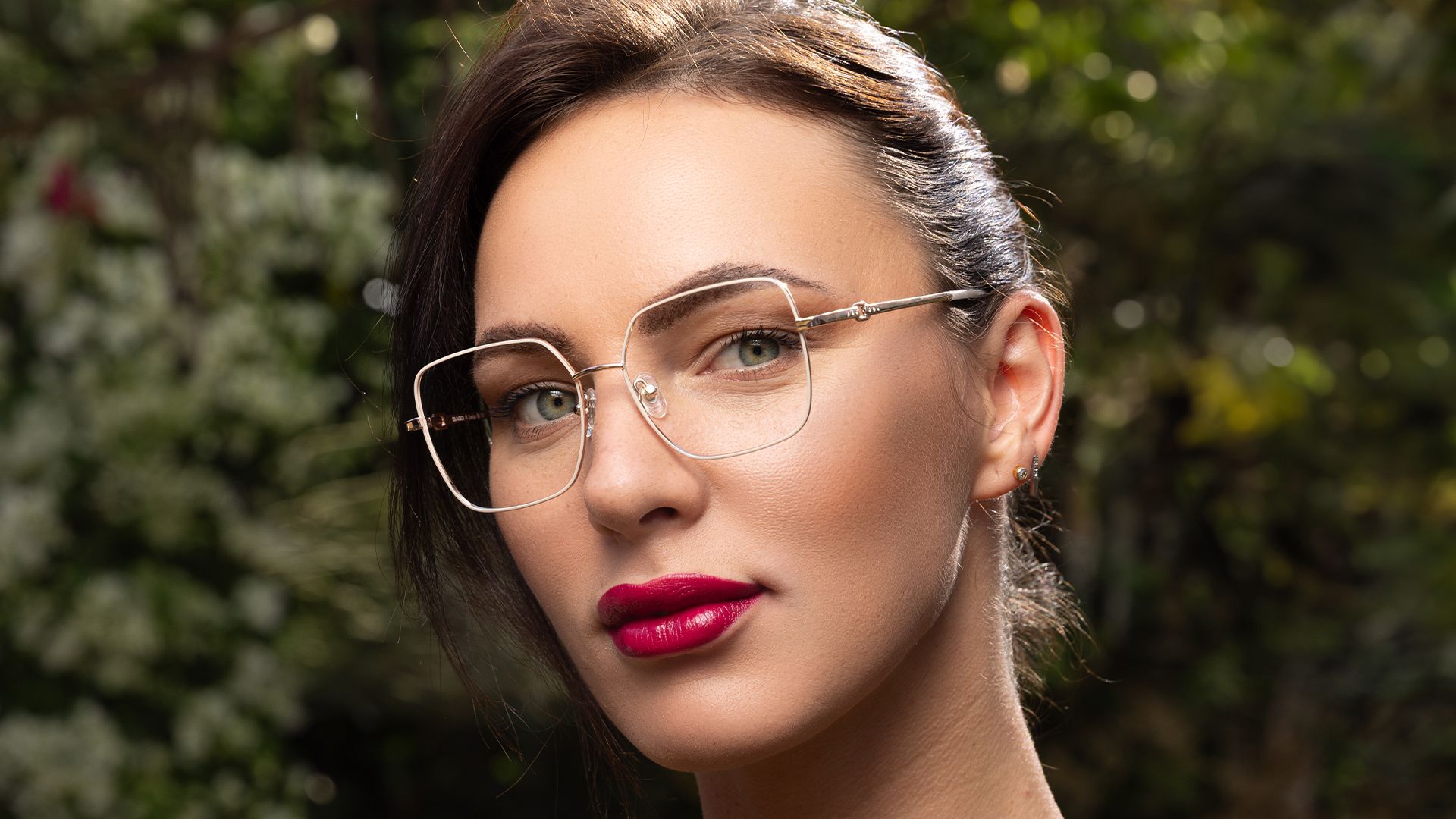 Woman wearing gold metal Biaggi optical frames